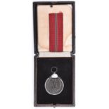 A Third Reich Eastern Front medal, GC, in a box with a length of ribbon. £30-40