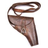 A scarce WWII flap top leather holster for a flare pistol, with leather belt loop stamped “E