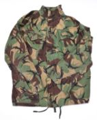 A Denison type camouflage smock, 4 pockets, zip up and 4 button front, with shoulder straps. GC (