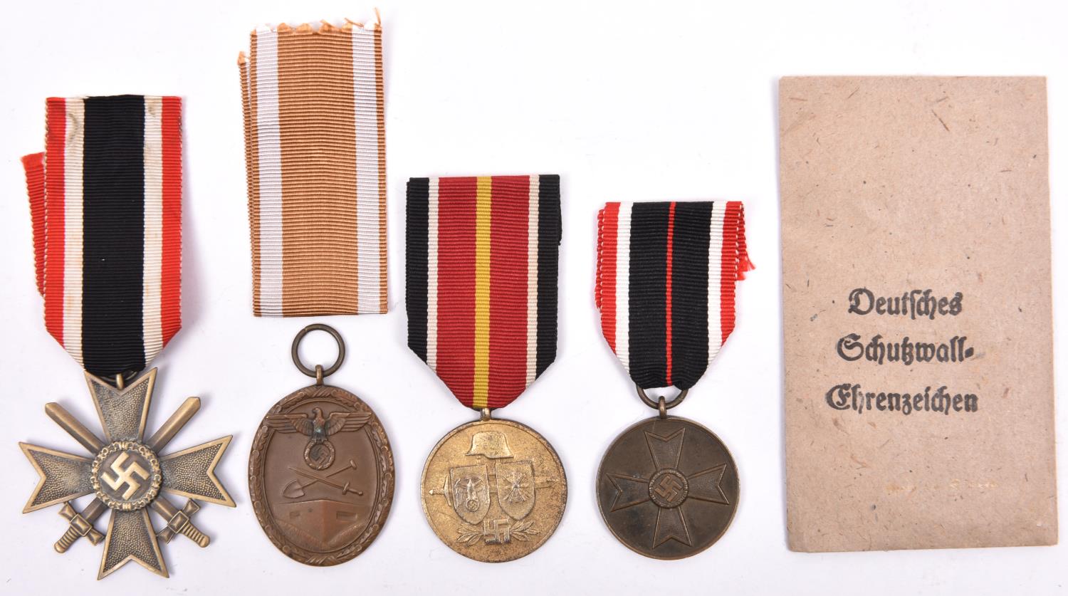 Third Reich medals: War Merit Cross 2nd Class with swords, War Merit Medal, West Wall Medal with