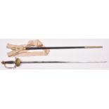 A Victorian court sword, slender blade 32” etched with crowned “VR”, scrolls, P.O.W. feathers, “By