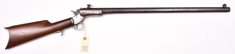 A .32” rimfire Stevens centre hammer tip down rifle, number 10431, 40½” overall, heavy octagonal