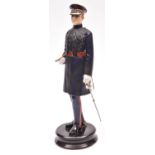 A fine Michael Sutty painted porcelain figure of an officer of the Scots Guards, (Model No. 25).