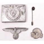 A Third Reich SS man”s buckle, of silver painted steel, with RZM mark, SS runes, and number “36/42”;