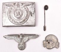 A Third Reich SS man”s buckle, of silver painted steel, with RZM mark, SS runes, and number “36/42”;