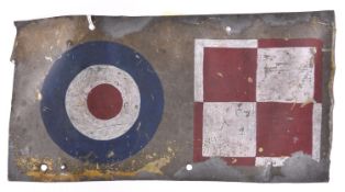 A rectangular aluminium panel, 12” x 6½”, with dull grey finish, painted with small RAF roundel