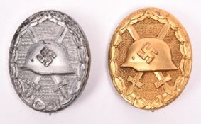 A Third Reich Wound badge in gold, the solid flat back embossed “L/63”; and another, die struck