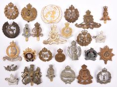 25 various Corps and other cap badges, including Artillery, GRVI Engineers, RAOC, GRVI RASC, Ryl