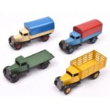 4 Dinky Toys 25 series trucks. Type 3 Market Gardeners Lorry 25f in yellow, with yellow wheels. Plus