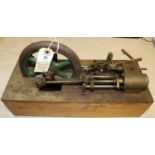 A live steam stationary engine. A scratch built single cylinder engine of some age. Generally well