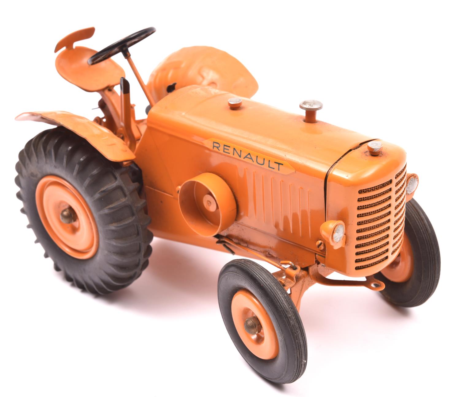 A rare 1950?s tinplate clockwork Renault tractor by CIJ Toys France. Finished in orange overall,