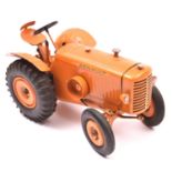 A rare 1950?s tinplate clockwork Renault tractor by CIJ Toys France. Finished in orange overall,