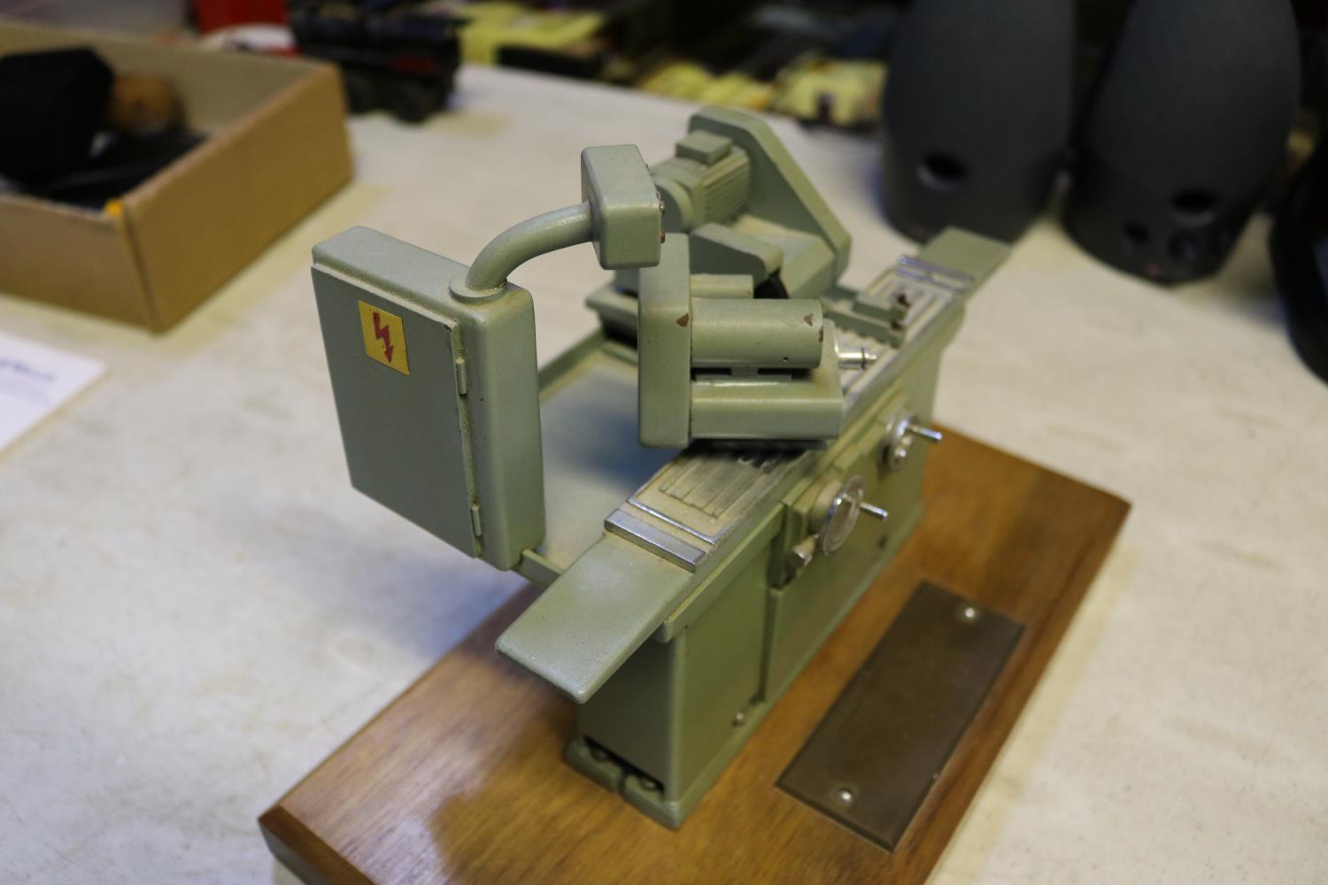 A small metal model of an industrial grinding machine. A well detailed model presented as a - Image 3 of 4