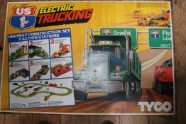 An HO gauge Tyco US 1 Electric Trucking set. A 1980s slot-car style 'Highway Construction Set with 5