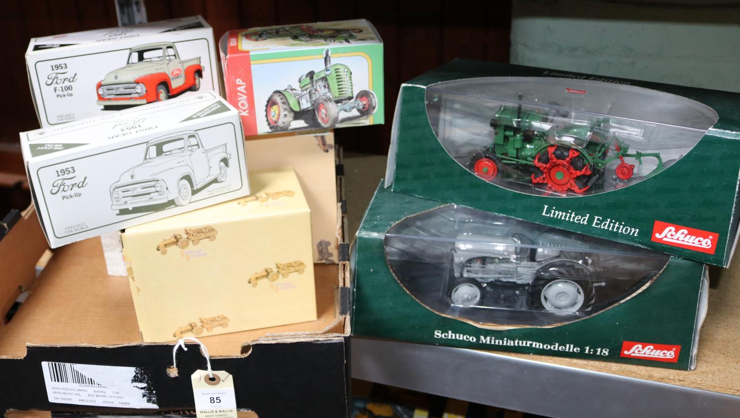 2 Schuco 1:18 Tractors. A Ferguson TE20 in light grey, plus a Deutz F1 M414 in green and red. Both