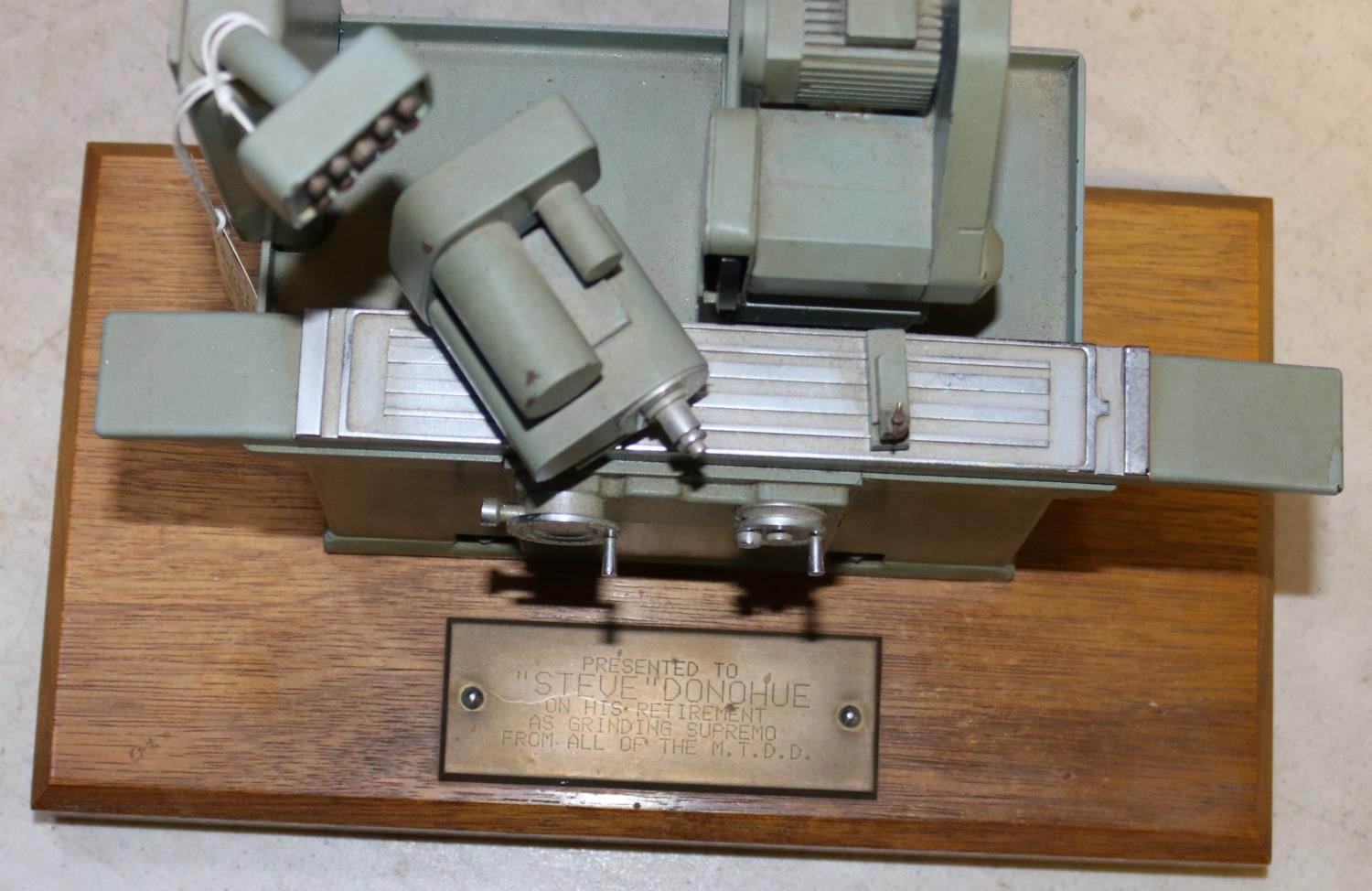 A small metal model of an industrial grinding machine. A well detailed model presented as a - Image 2 of 4