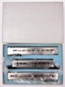 An HO gauge Japanese manufactured American outline 3-car articulated coach in possibly steel on 4x