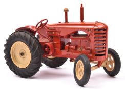A large scale Moko Lesney Massey Harris Tractor. In red with cream wheels and black rubber tyres.