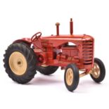 A large scale Moko Lesney Massey Harris Tractor. In red with cream wheels and black rubber tyres.