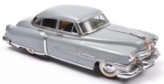 An impressive Japanese Tinplate Marusan Toys Kosuge (SAN) 1953 Cadillac Fleetwood Saloon. A friction