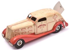 An American MARX 1930's Heavy Tinplate Clockwork Ambulance. In cream with red chassis and wings, red