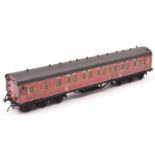 An O gauge 12-wheel Brake First compartment coach by Stedman. Litho printed paper sides in lined
