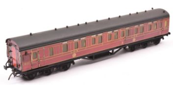 An O gauge 12-wheel Brake First compartment coach by Stedman. Litho printed paper sides in lined