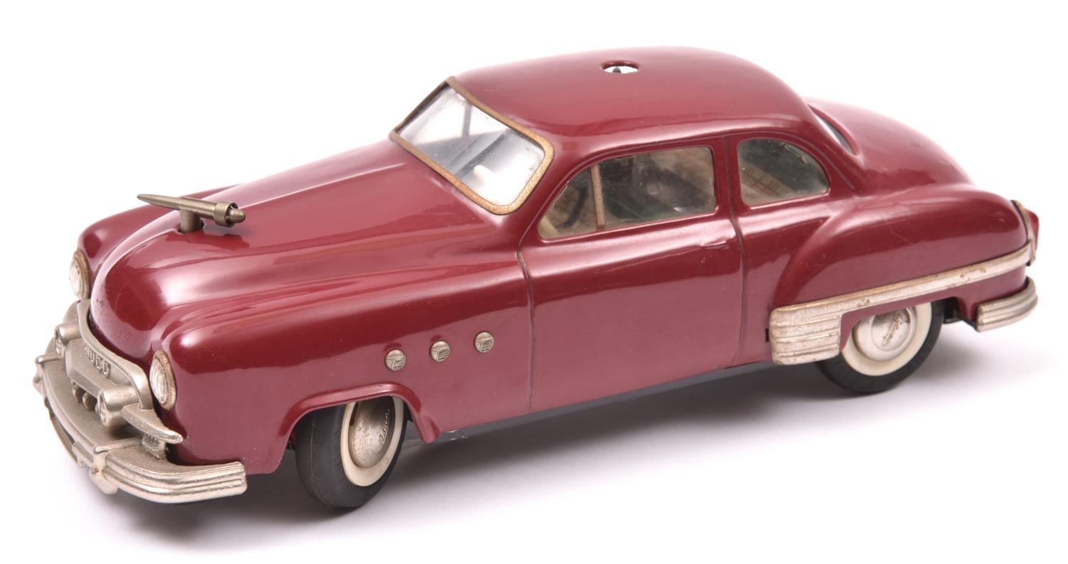 Schuco - Patient-Ingenico 5311 Tinplate 2 Door Saloon. A 1950's American style car in maroon with - Image 2 of 4