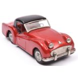 Bandai Tinplate Friction Powered Triumph T.R.3. An example in metallic red with black roof, L.H.D.