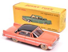 French Dinky Toys De Soto Diplomat (545). An example in salmon pink with a black roof, dished spun