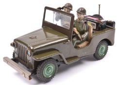 A 1960's Japanese T.N. (Nomura Toys) U.S. Army Jeep. A battery powered example with 'mystery