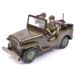 A 1960's Japanese T.N. (Nomura Toys) U.S. Army Jeep. A battery powered example with 'mystery