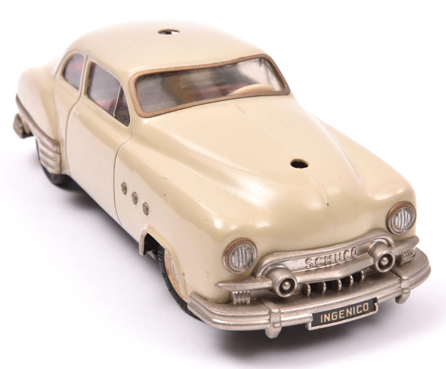 Schuco - Patient-Ingenico 5311 Tinplate 2 Door Saloon. A 1950's American style car in beige with a - Image 2 of 3