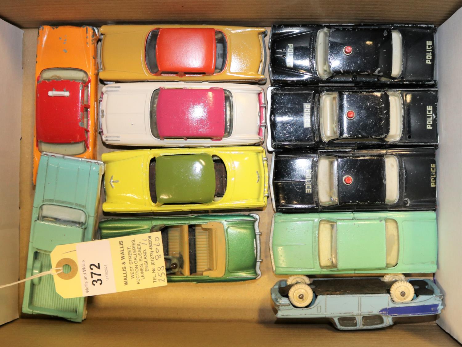 11 Dinky Toys American Cars. Dodge Royal Sedan, Cadillac and a Ford Fairlane, all Police cars.