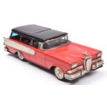 A late 1950's Japanese Haji Tinplate Friction Powered Ford Edsel Station Wagon. In red with black