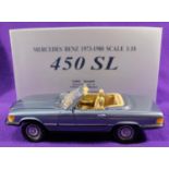 A CMC 1:18 scale Mercedes-Benz 450SL. A top down example in light metallic blue with fawn