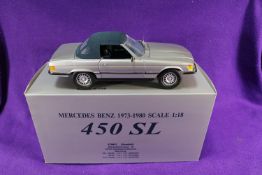 A CMC 1:18 scale Mercedes-Benz 450SL. A top up example in metallic silver with dark blue roof and