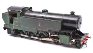 A live steam coarse scale O gauge locomotive. Spirit fired 2 cylinder tinplate model of a Great