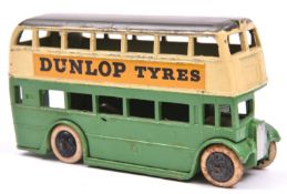 A scarce Dinky Toys AEC Double Deck Bus. An early example (1938) in green and cream with grey