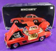 Minichamps 1:18 1954 Mercedes-Benz 300SL 'Gull Wing'. An example in bright red with a tan