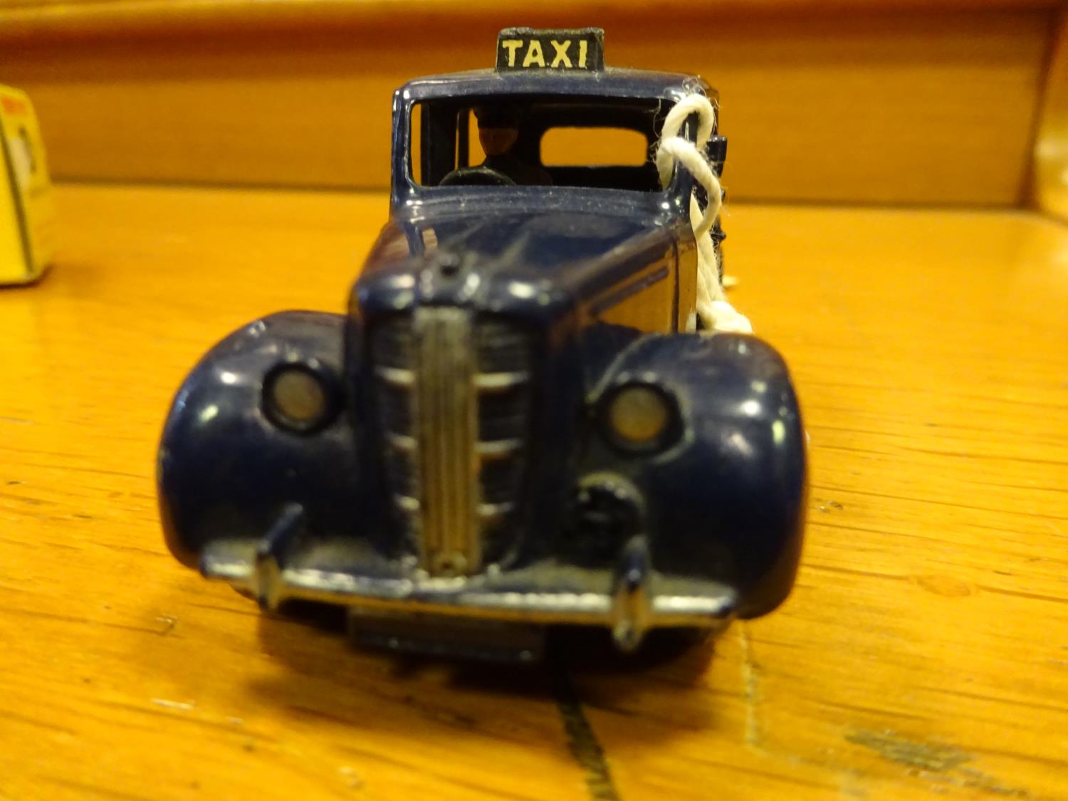 Dinky Toys Austin Taxi (254). A scarce example in dark blue with mid blue wheels and black tyres. - Image 2 of 5