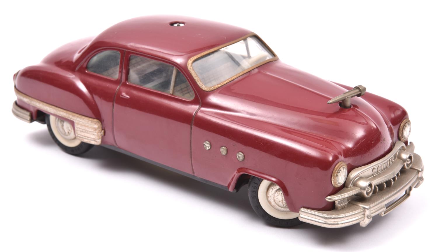 Schuco - Patient-Ingenico 5311 Tinplate 2 Door Saloon. A 1950's American style car in maroon with