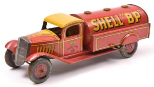 A Scarce Wells Tinplate Clockwork Petrol Tank Wagon. In red/yellow livery, with 'SHELL 'BP'' to tank