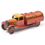 A Scarce Wells Tinplate Clockwork Petrol Tank Wagon. In red/yellow livery, with 'SHELL 'BP'' to tank