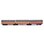 An O gauge possibly Leeds Model Co. LNER 3-car articulated coach set. Teak coaches mounted on 4