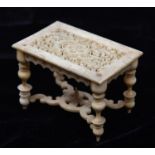 A very finely worked mid 19th Century oriental ivory doll's house model table with 17th Century