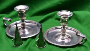 A pair of silver chamber candlesticks with large dish bases, carrying handles, snuffers and