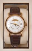 A Patek Philippe, Geneve Automatic watch with automatic winding mechanism. Gold case, white metallic