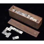 A 19th Century Domino set. 49x playing pieces of bone and ebony (or ebonised wood) construction,