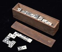 A 19th Century Domino set. 49x playing pieces of bone and ebony (or ebonised wood) construction,